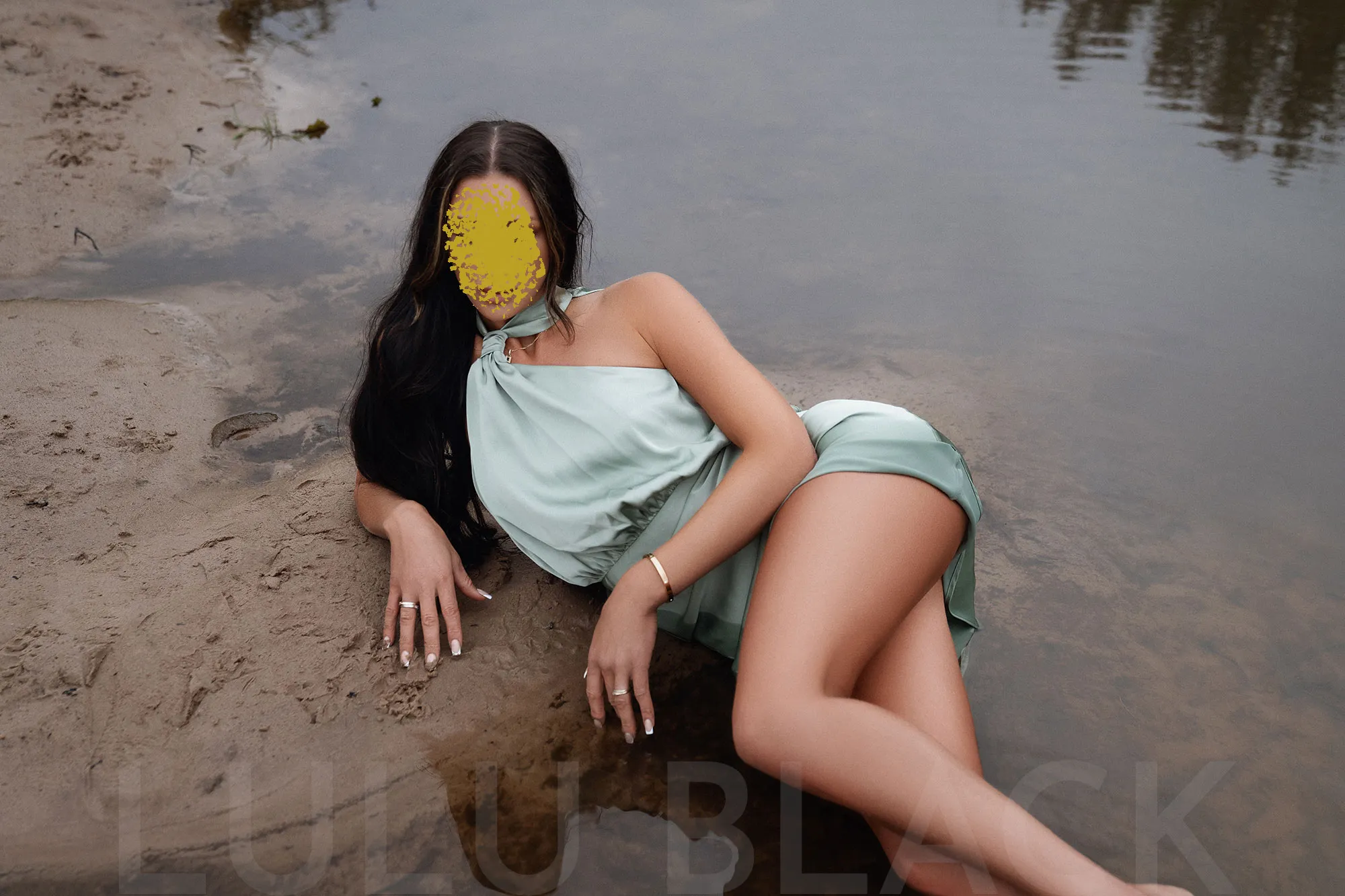 Gateshead escort posing in water in a mint green dress - braving the North East elements!